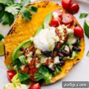 Crockpot Chicken Tacos ready to be enjoyed, garnished with fresh toppings.