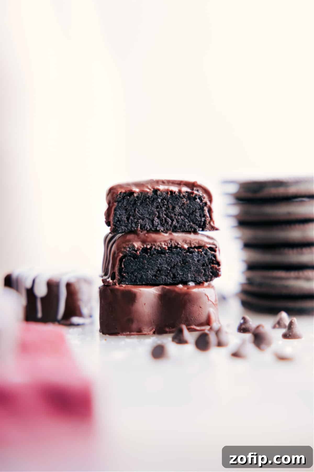 A stunning image of several Heart Oreo Truffles artfully stacked, showcasing their perfect form and inviting chocolate coating.