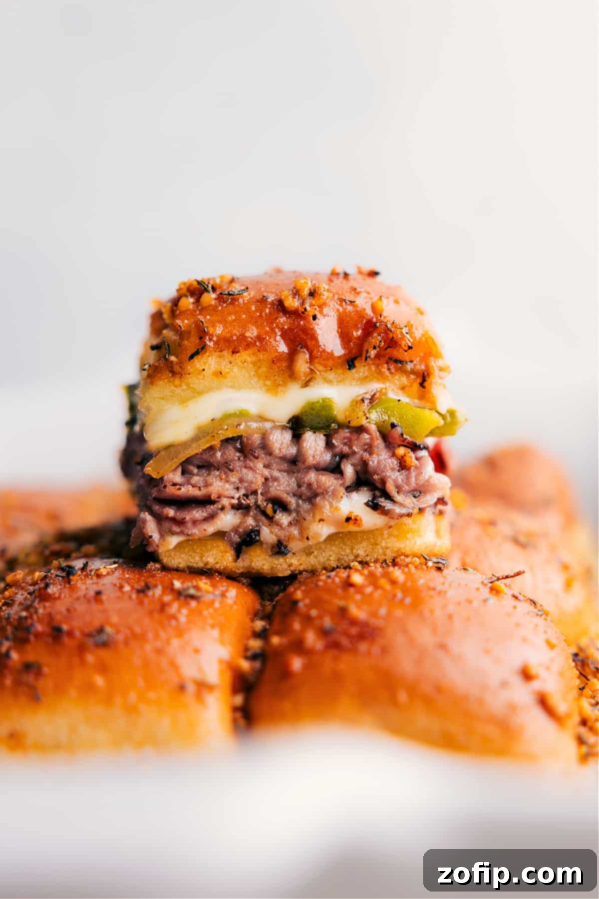 Philly Cheesesteak Sliders fresh out of the oven, golden brown and melty.