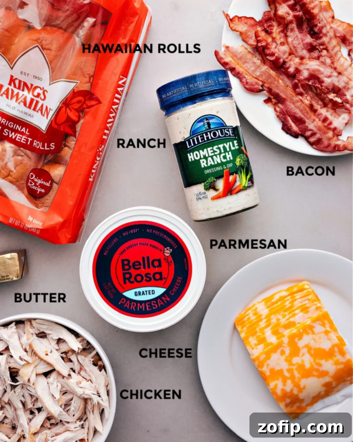 The Best Chicken Bacon Ranch Sliders Start with Quality Ingredients All the fresh ingredients for Chicken Bacon Ranch Sliders prepped and laid out for easy assembly, including shredded chicken, crispy bacon, cheese slices, ranch dressing, and Hawaiian rolls.