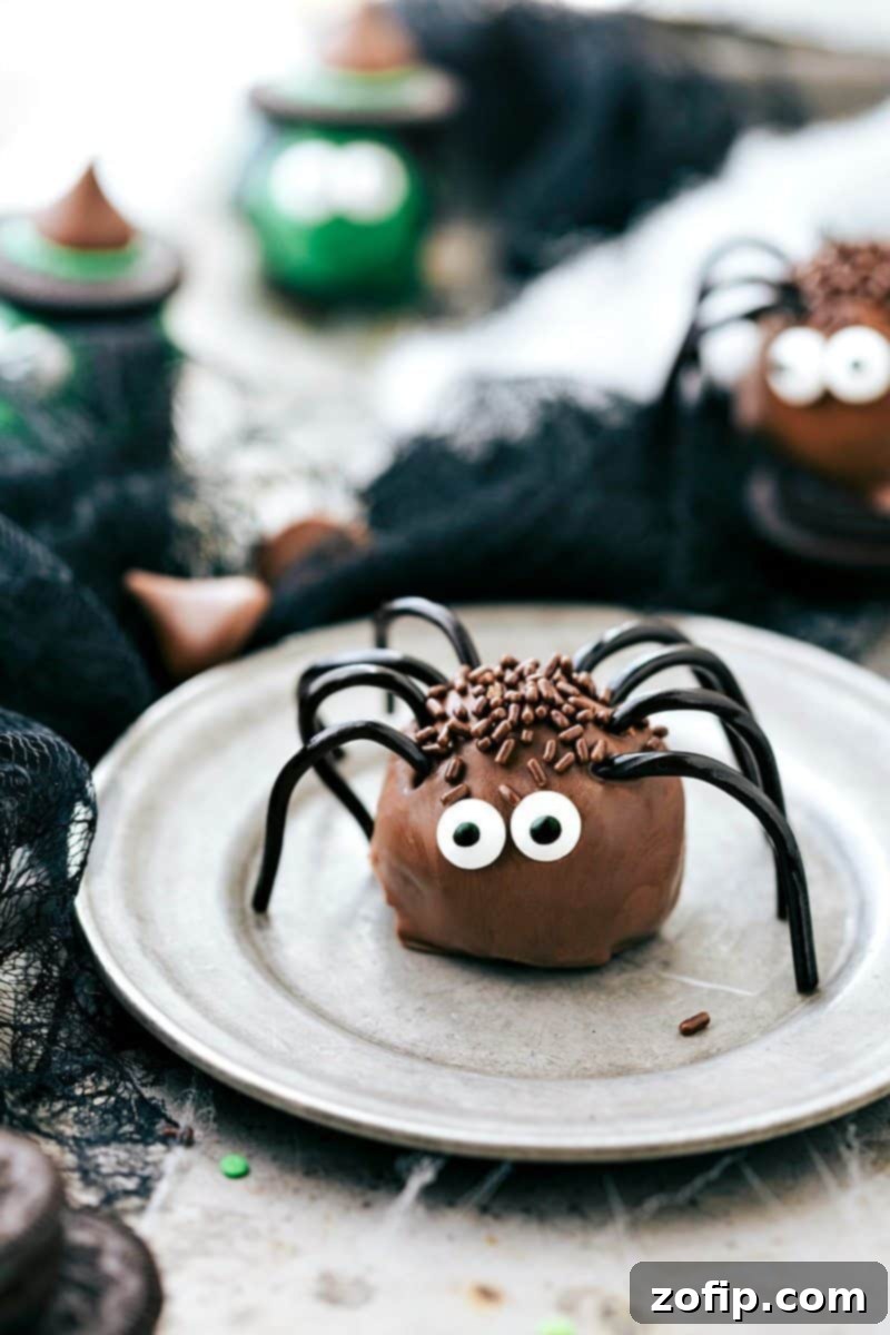 Spooky Oreo Truffles 7 Creepy-crawly Spider Oreo Balls: Chocolate truffles with licorice legs and edible eyes, a fun and easy Halloween treat.