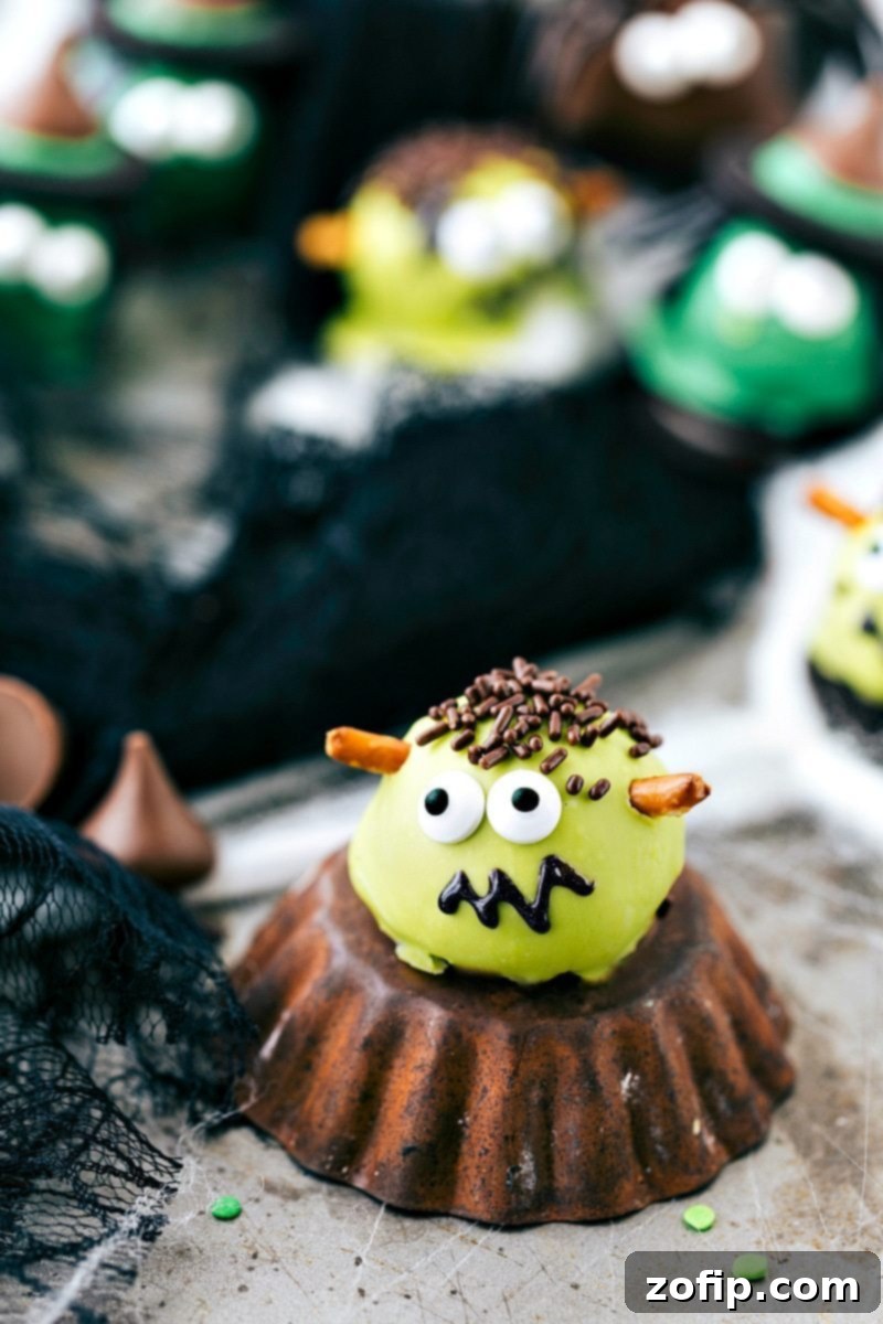Spooky Oreo Truffles 8 Iconic Frankenstein Oreo Ball: Green truffle with pretzel bolts, edible eyes, and a stitched smile, perfect for Halloween fun.