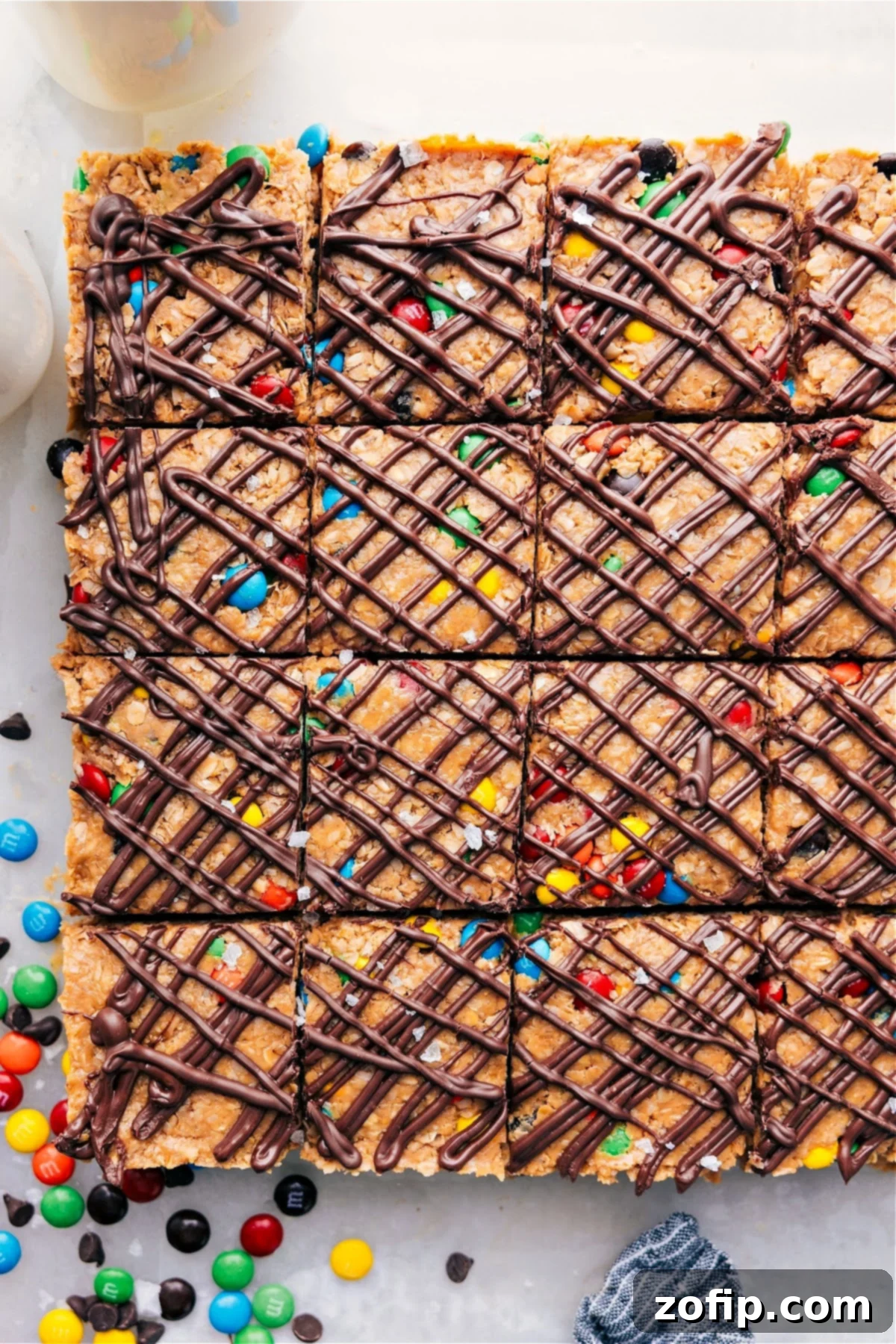 Freshly cut no-bake energy bars arranged neatly on a platter, showcasing their delicious texture and vibrant M&M's.