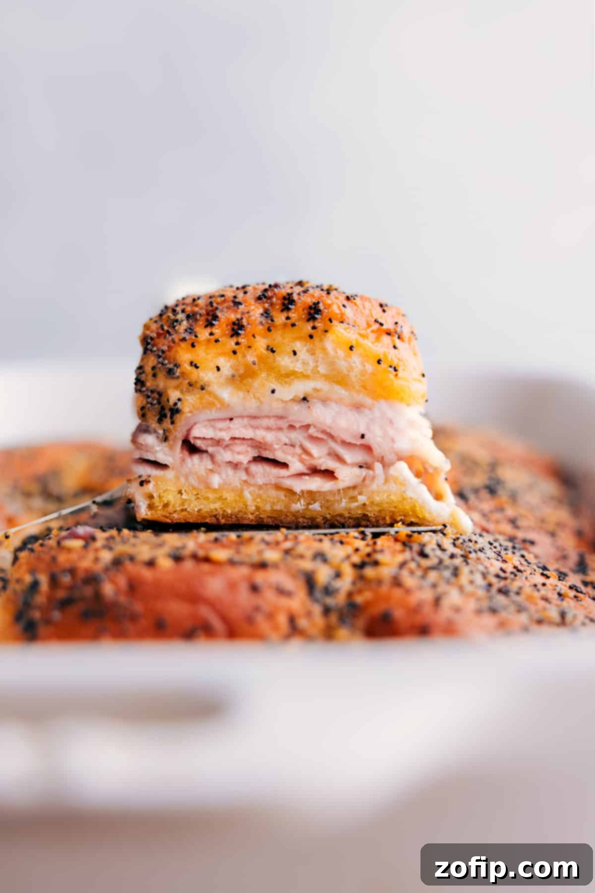 Freshly baked Turkey Sliders emerging golden and bubbly from the oven, ready to be served.