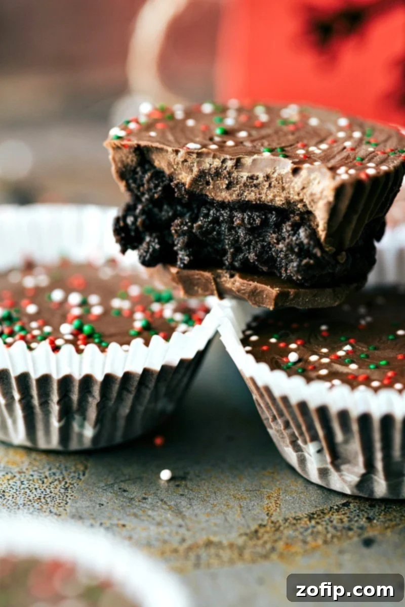 Delicious Thin Mint Oreo Cups: Easy 3-Ingredient Christmas Candy with Creamy Oreo Filling and Andes Mint Chocolate for Holiday Gifting. Image of the thin mint cups, a 3-ingredient Christmas candy made with Oreos, cream cheese, and Andes Mint baking chips.