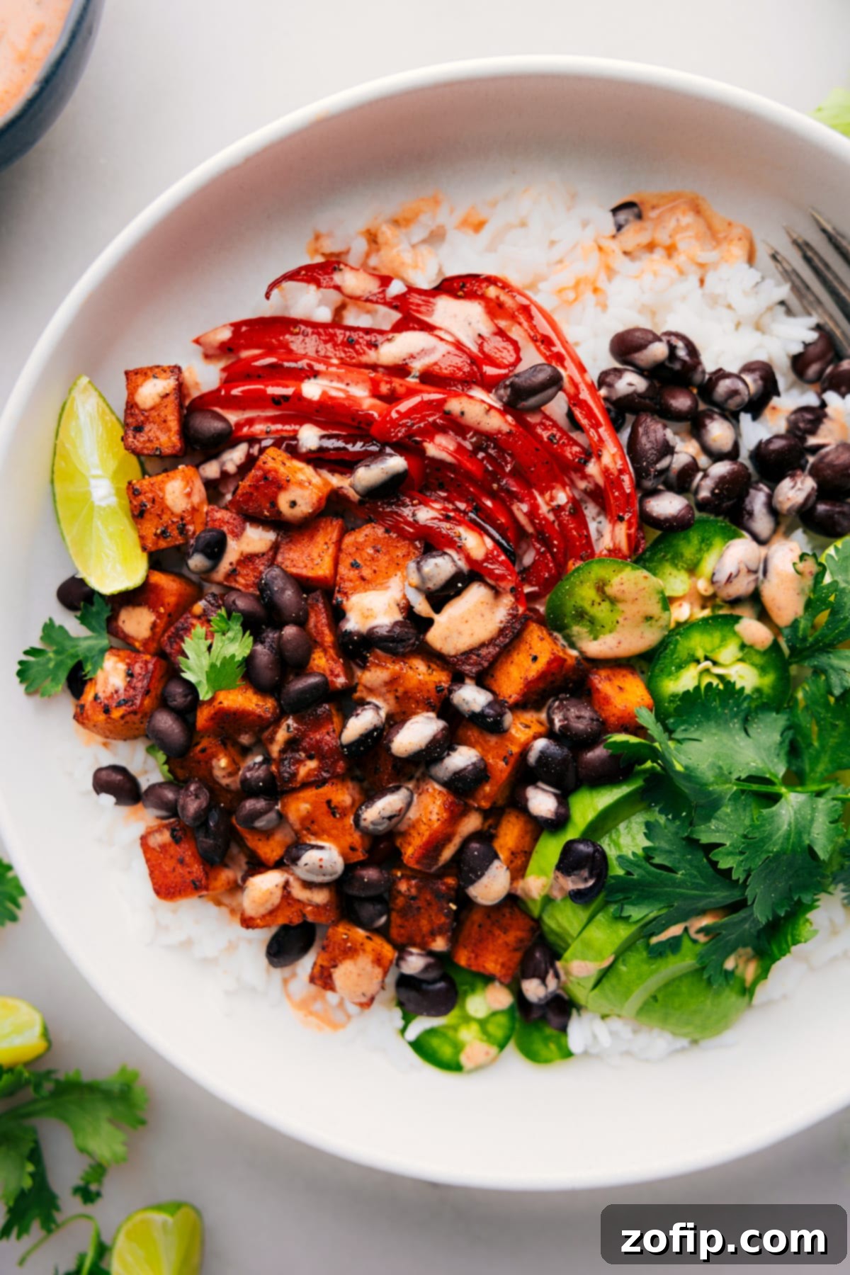 Sweet Potato and Black Bean Burrito Bowls, colorfully assembled and ready to be enjoyed.