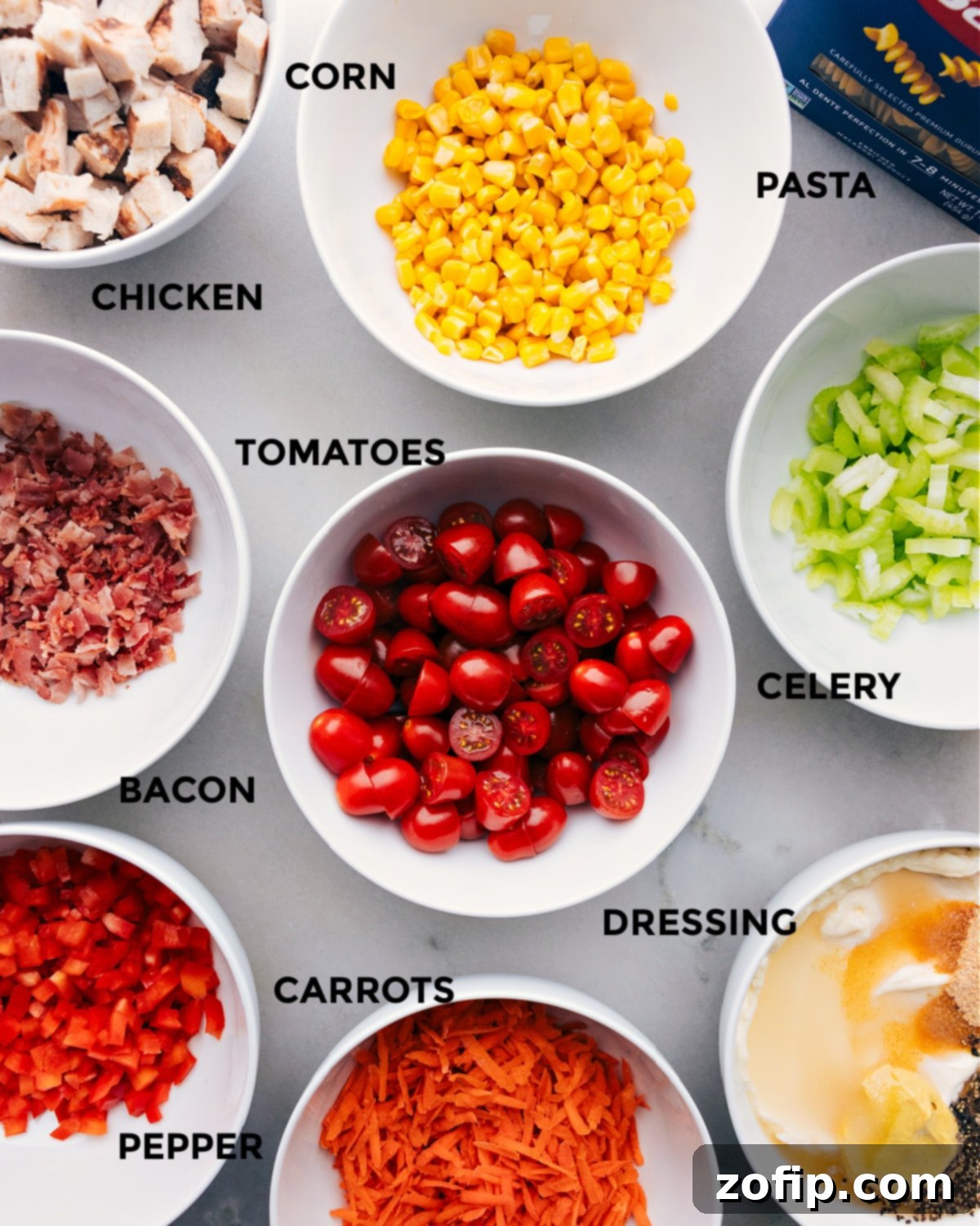 All the fresh ingredients for Chicken Pasta Salad prepped and laid out for quick assembly.