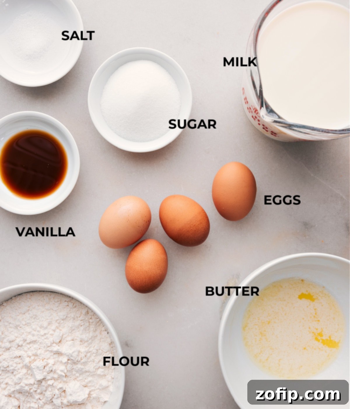 Ingredients used in the recipe, including flour, milk, sugar, eggs and vanilla.
