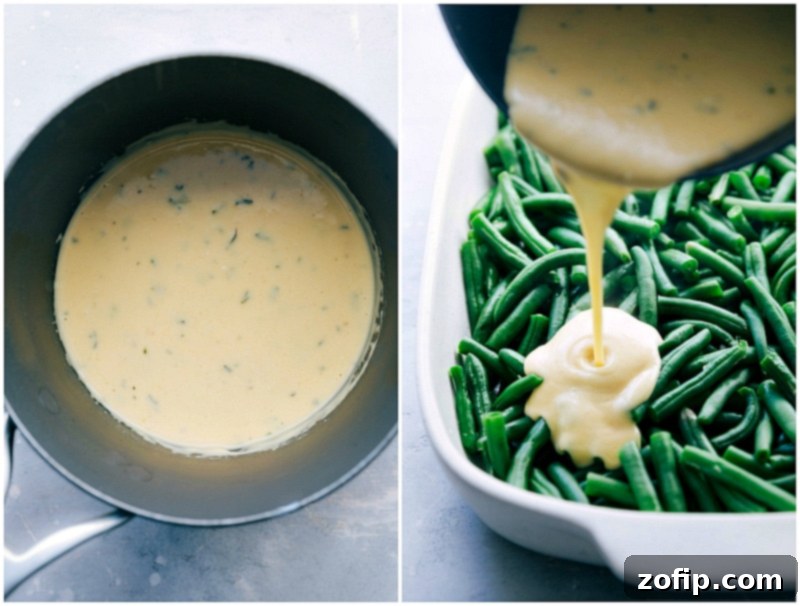 Rich, creamy cheese sauce being generously poured over blanched green beans in a casserole dish for a luscious coating.