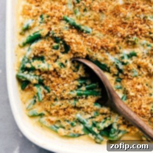 Ready-to-eat green bean casserole in a pan, showcasing its crisp top.