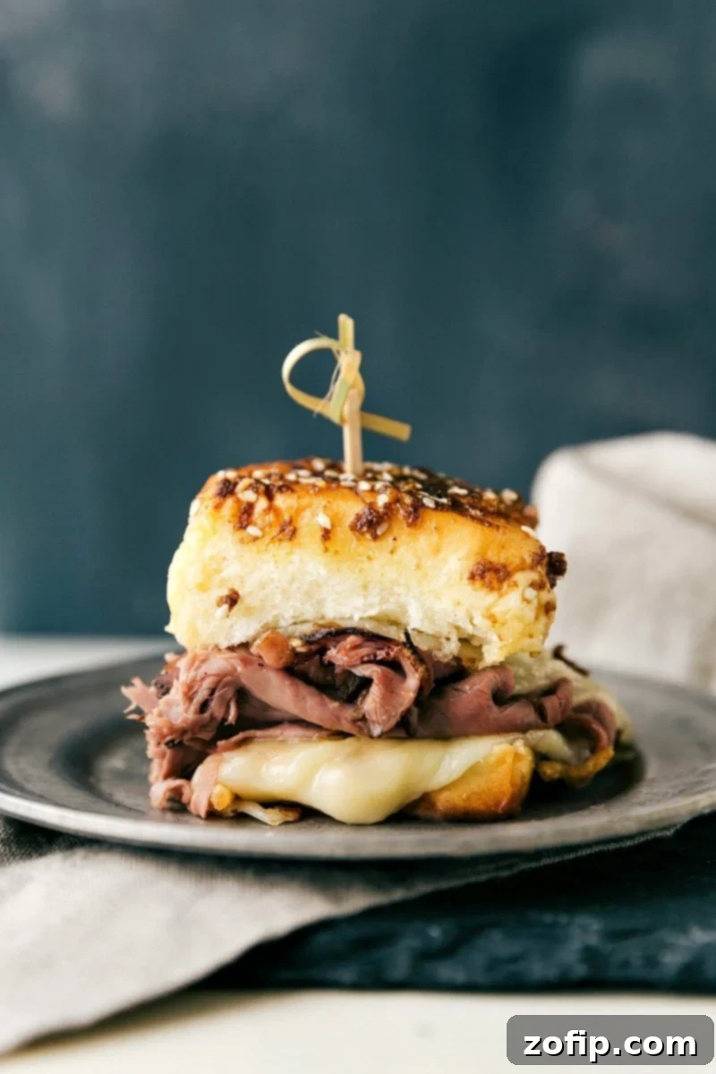 The best possible version of French Dip sandwiches The sandwich on a plate.