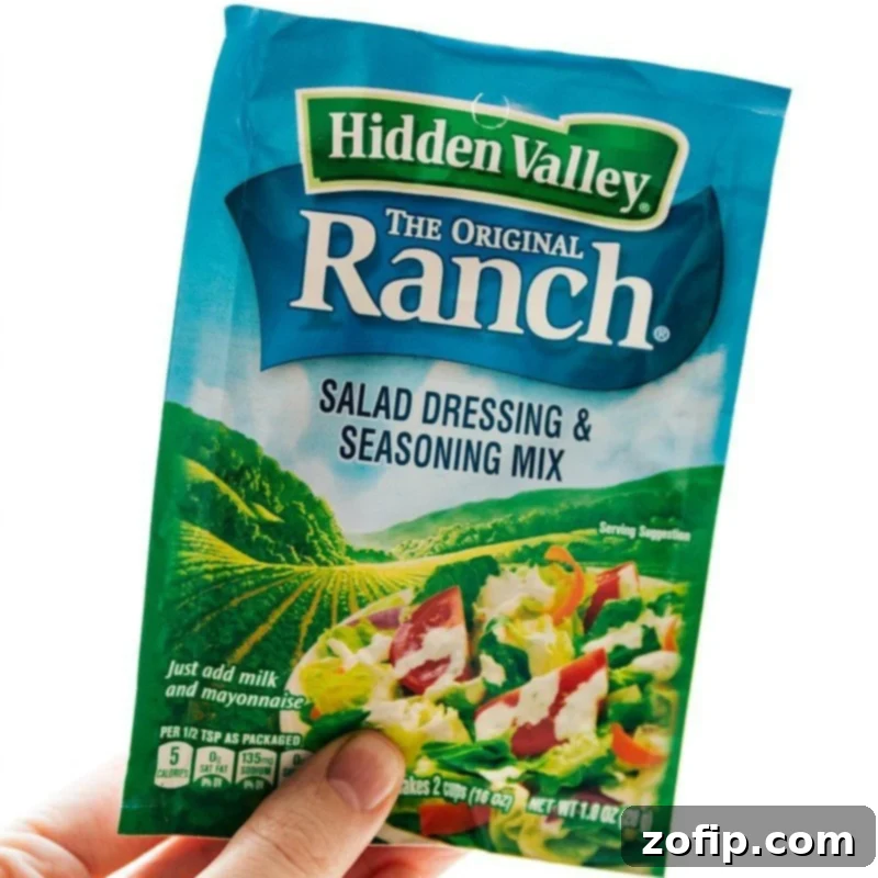 The ranch salad dressing and seasoning mix used in the recipe, showcasing the key flavor enhancer.