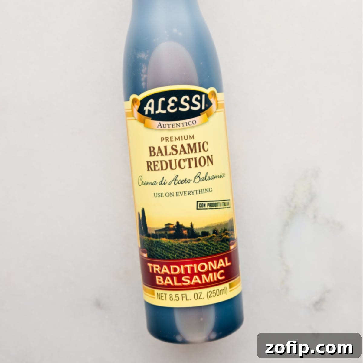 A bottle of rich balsamic reduction, a key ingredient for adding a quick and savory finish to the cottage cheese toast.