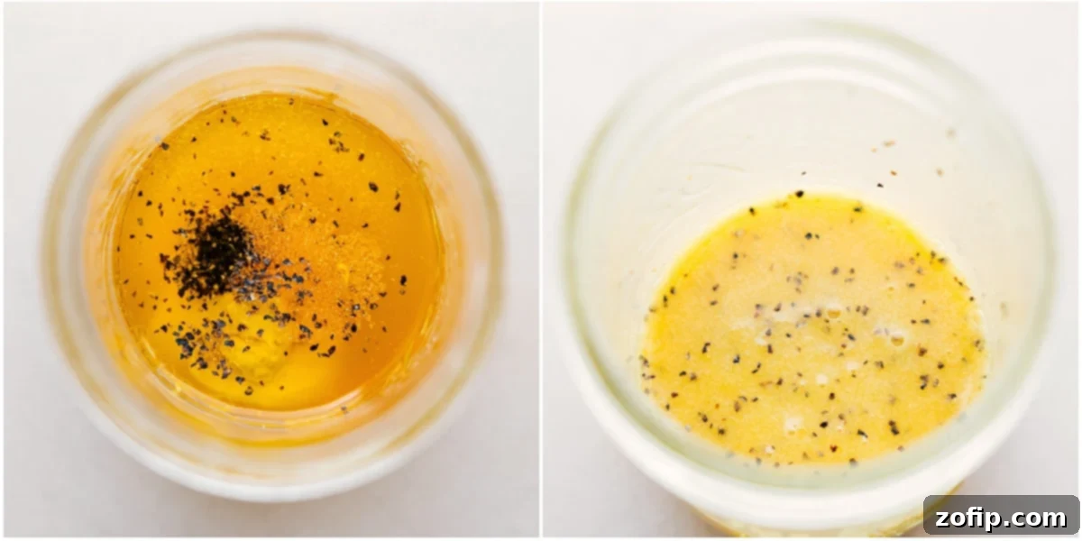 A close-up shot of the vibrant green kale and cabbage being thoroughly mixed together in a large serving bowl, showcasing the fresh, prepared ingredients ready for dressing and almonds.