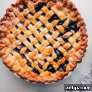 Foolproof Pie Crust 3 Freshly baked berry pie made with the best pie crust recipe, ready to be served, showcasing a golden, flaky crust.