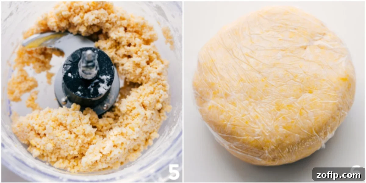 Simple And Fool-Proof Pie Crust Recipe Ready for Baking Thick, perfectly rolled pie dough, freshly prepared from the food processor, now resting on plastic wrap, ready for chilling before being pressed into the pie pan. The surface is smooth and uniform, indicating proper preparation.