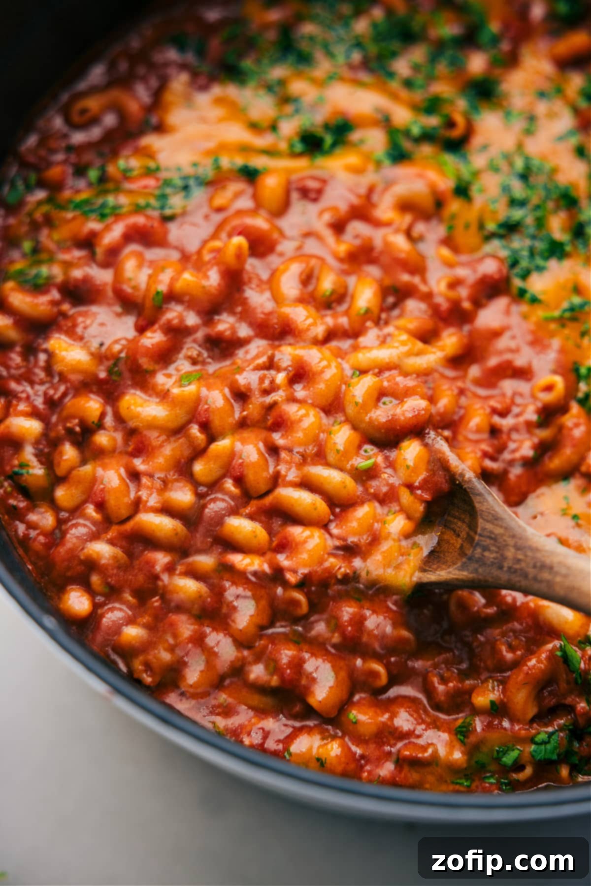 One pot chili mac freshly made in the pot, steaming warmly and ready to serve.