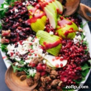 Jeweled Pear and Pomegranate Salad 2 A vibrant, healthy salad featuring pears, ready to be lightly tossed and served as a delightful side dish or light meal.