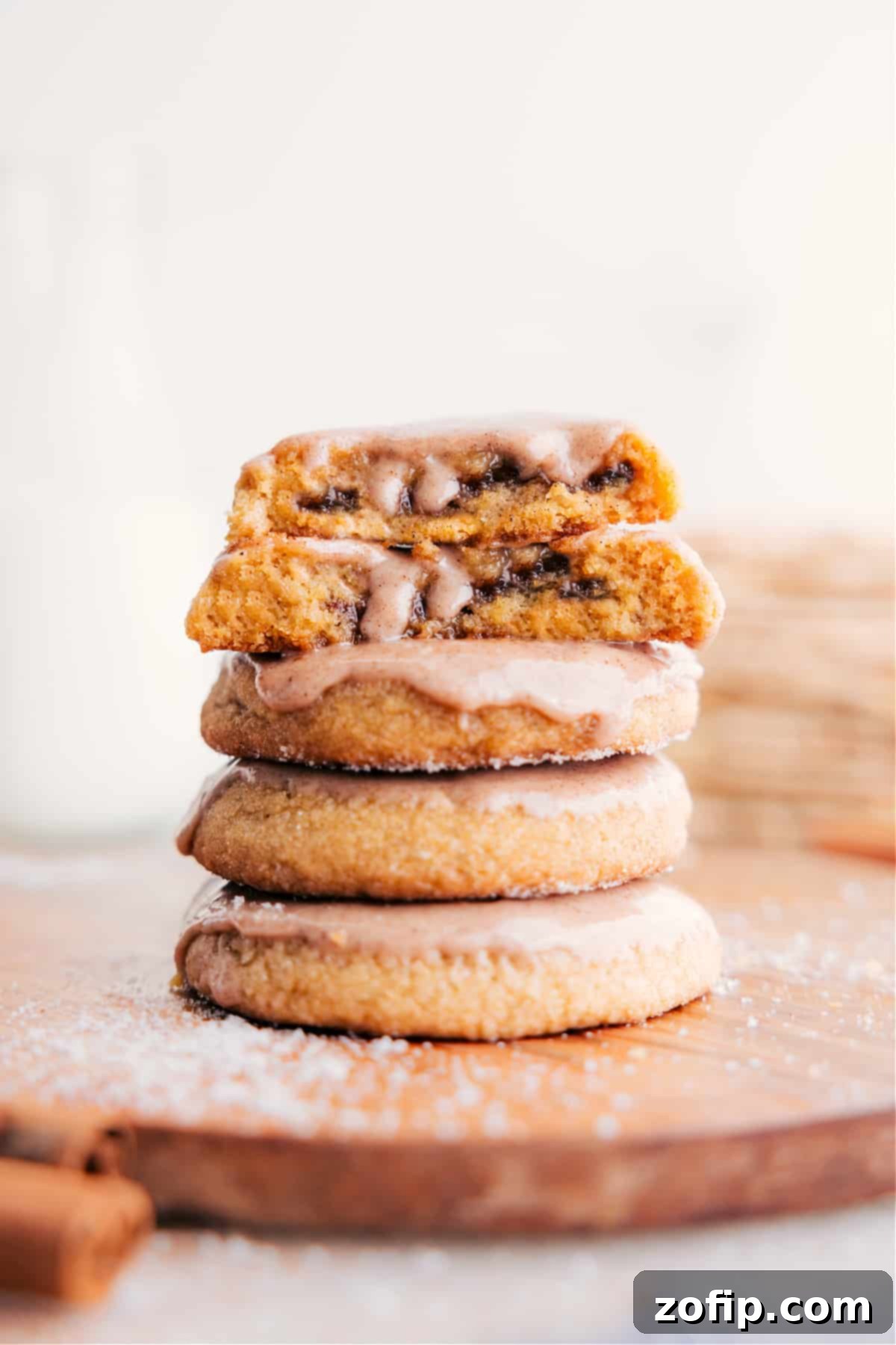 Stack of freshly baked Brown Sugar Pop-Tart Cookies, with one sliced to show the rich cinnamon-sugar filling.