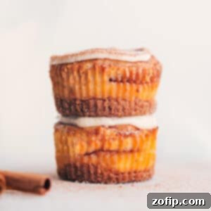 Mini Cinnamon Roll Cheesecakes with frosting on top