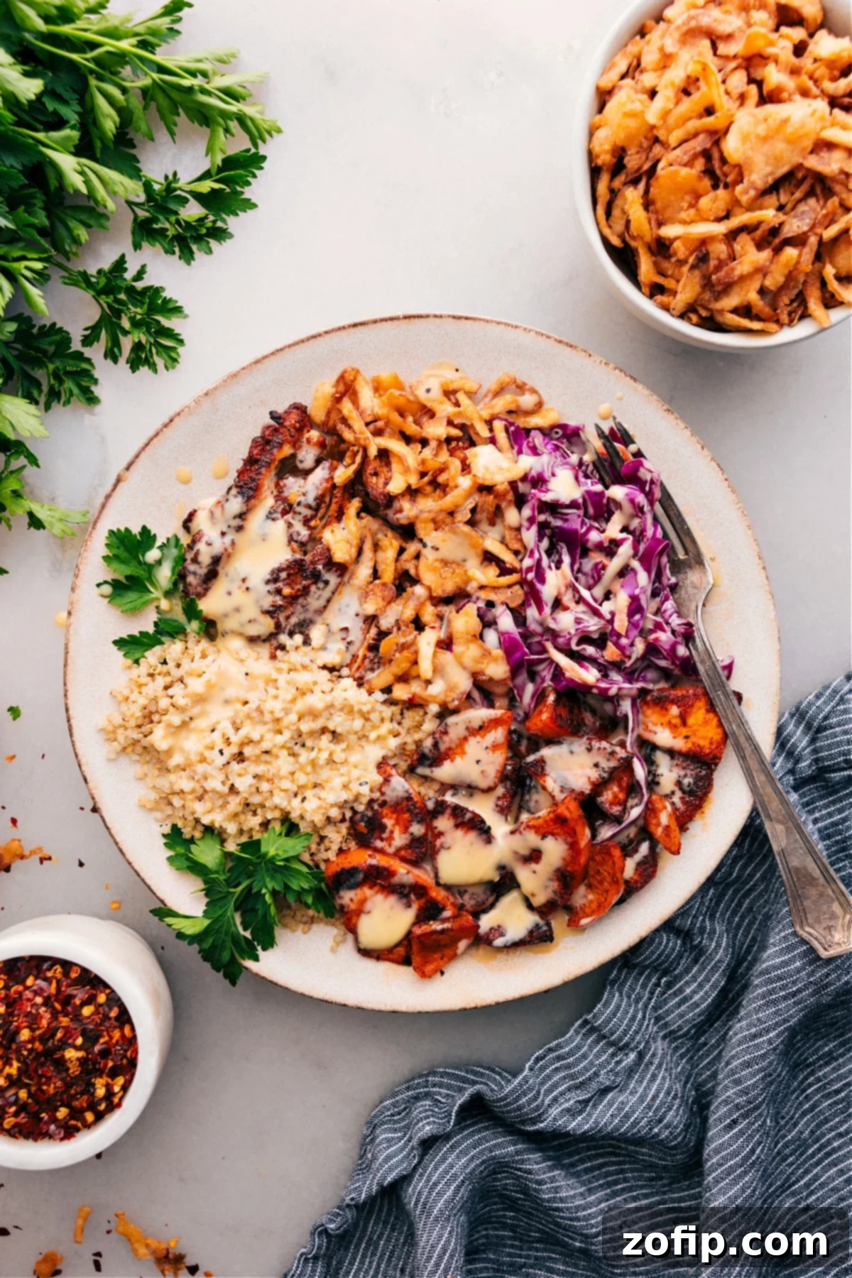 The Best Hot Honey Chicken Bowl Recipe for Meal Prep A beautifully assembled Hot Honey Chicken Bowl, topped with creamy dressing and ready to be enjoyed.
