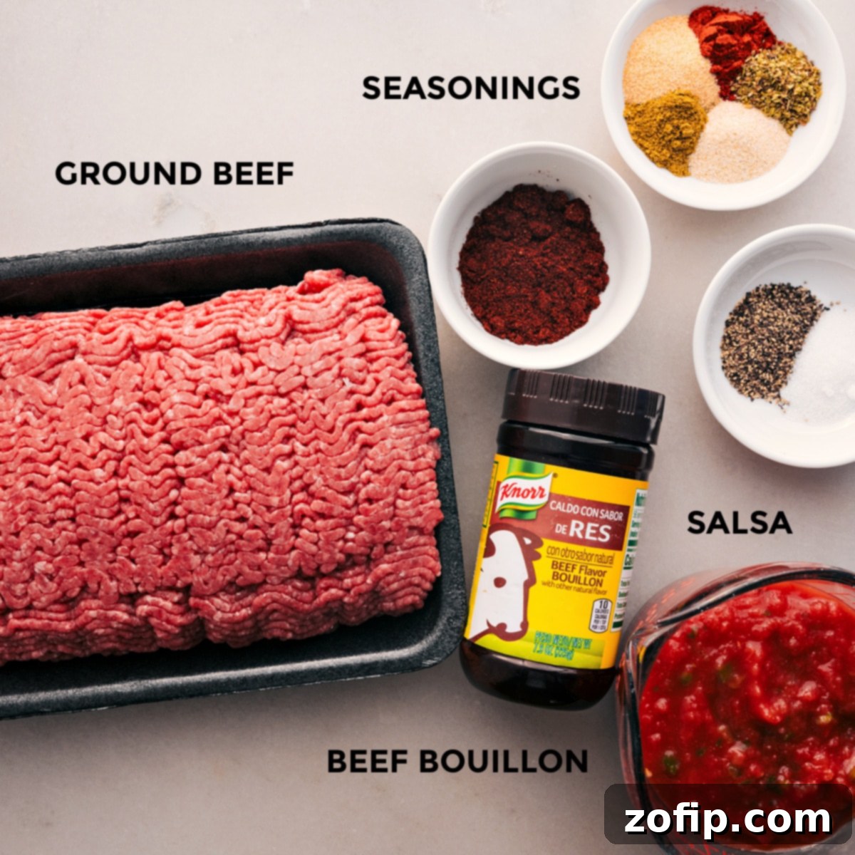 All the fresh and vibrant ingredients for this Crockpot Taco Meat recipe, including lean ground beef, a colorful array of spices, and a bowl of fresh mild salsa, neatly prepped and ready for assembly.