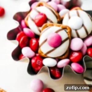 Close-up of Heart Hug Pretzels with red, pink, and white M&Ms, a simple Valentine's treat.