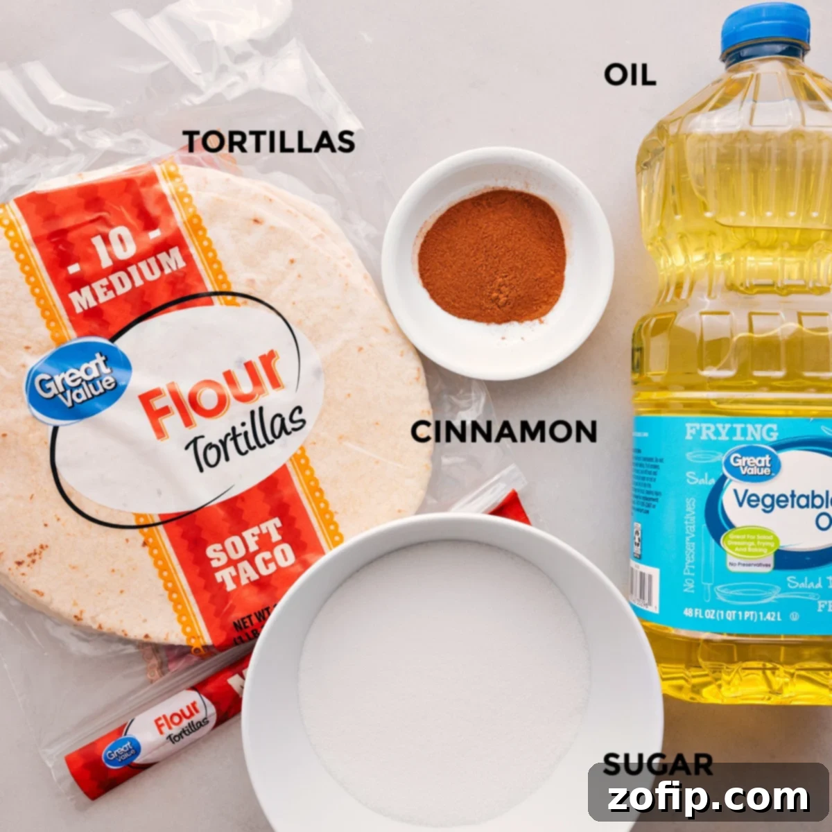 Essential ingredients for Cinnamon Sugar Chips: flour tortillas, granulated sugar, ground cinnamon, and cooking oil.