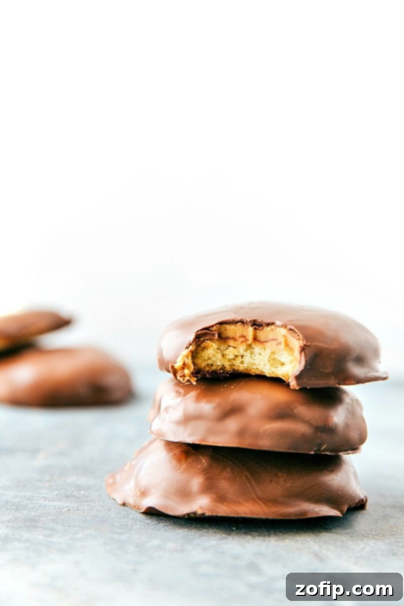 Homemade 4-ingredient Tagalong cookies (Peanut Butter Patties) with a crisp cookie base, peanut butter topping, and chocolate coating.