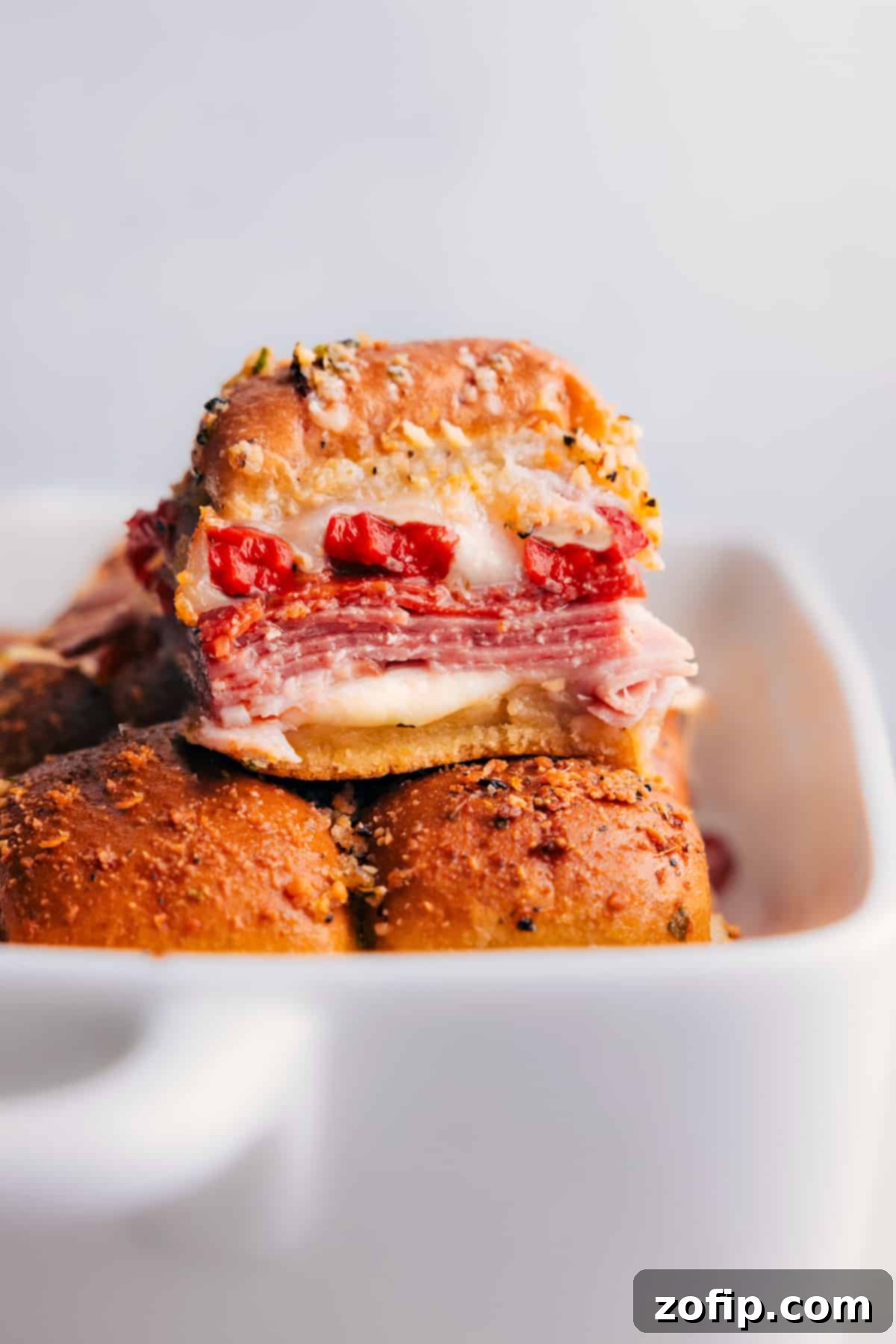 Irresistible Italian Sliders fresh out of the oven, showcasing their golden crust and melted cheese.