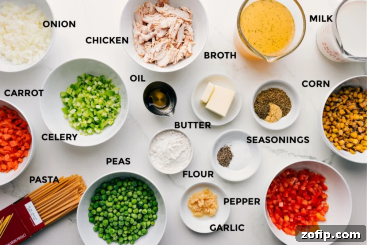 Prepped ingredients for creamy chicken noodle soup including diced onion, carrot, celery, red pepper, spaghetti, frozen peas, frozen corn, cooked chicken, olive oil, butter, flour, minced garlic, dried thyme, Italian seasoning, chicken bouillon, dried basil, dried oregano, salt, pepper, chicken broth, and milk.