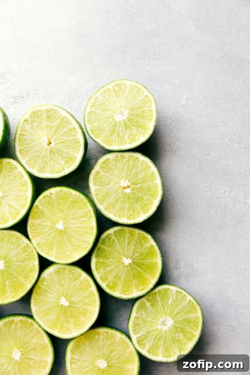 View of halved fresh limes, ready to be juiced for a refreshing mocktail.