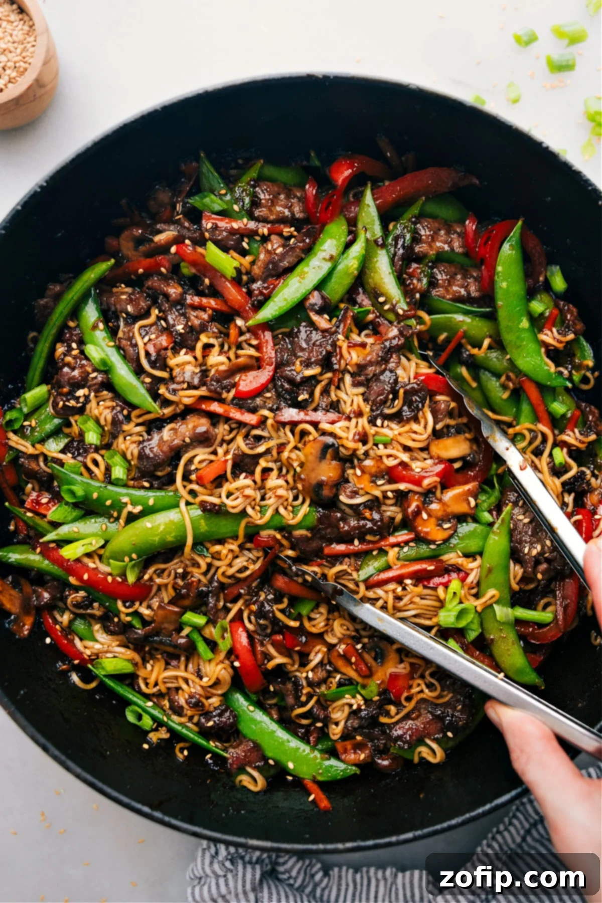 The Best Garlic Beef and Veggie Ramen Recipe A steaming bowl of Garlic Beef and Veggie Ramen with tender beef, colorful vegetables, and noodles in a rich broth.