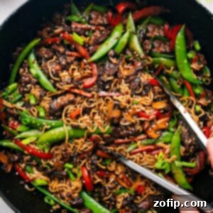 Hearty Garlic Beef and Vegetable Ramen 2 Finished Garlic Beef and Veggie Ramen dish, garnished with green onions and sesame seeds.