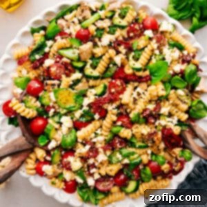 Irresistible Chicken Pasta Salad 2 Close-up of Marry Me Chicken Pasta Salad in a bowl, showcasing the vibrant colors and fresh ingredients.