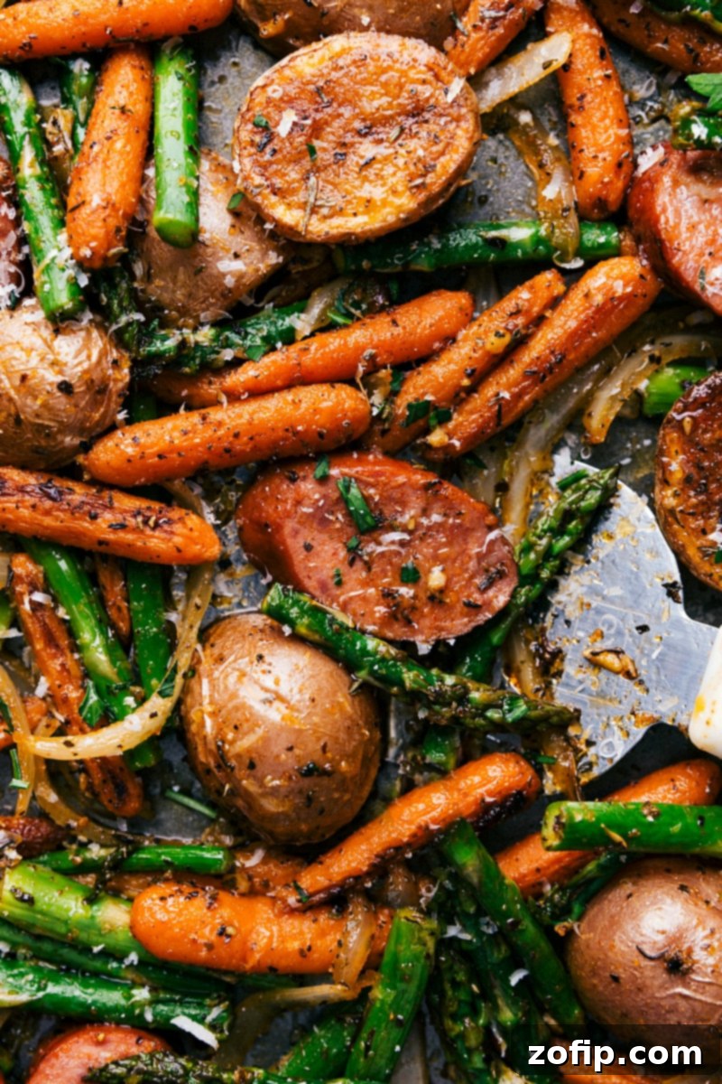 A mouthwatering assortment of vegetables, sausage, and spices in the finished one-pan potatoes and sausage dish, ready to be savored.