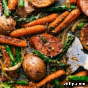 A mouthwatering assortment of vegetables, sausage, and spices in the finished meal, ready to be savored.