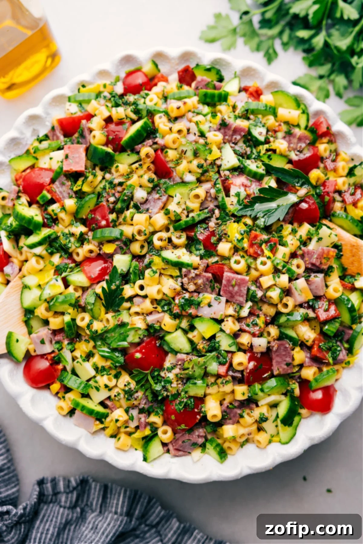 Italian Grinder Pasta Salad sits in a bowl, ready to enjoy.