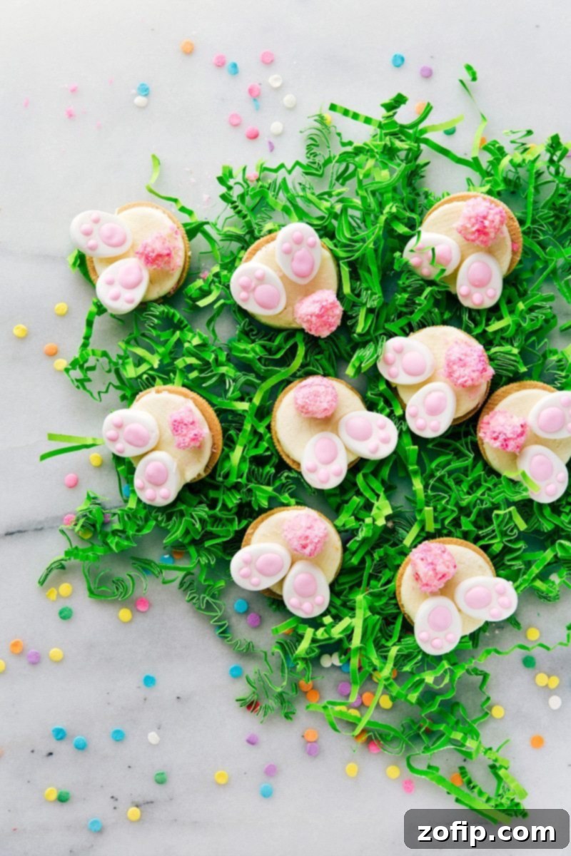 4 Easy Easter Treats 2 A beautiful spread of four simple Easter treats: Bunny Bum Cookies, Easter Bunny Cinnamon Rolls, Easter Egg Nests, and Mini Egg Petit Fours, perfect for any celebration.