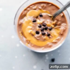 Creamy Peanut Butter Overnight Oats 2 Peanut butter overnight oats, ready to be enjoyed on the go, with a peanut butter swirl mixed in and topped with chocolate chips.