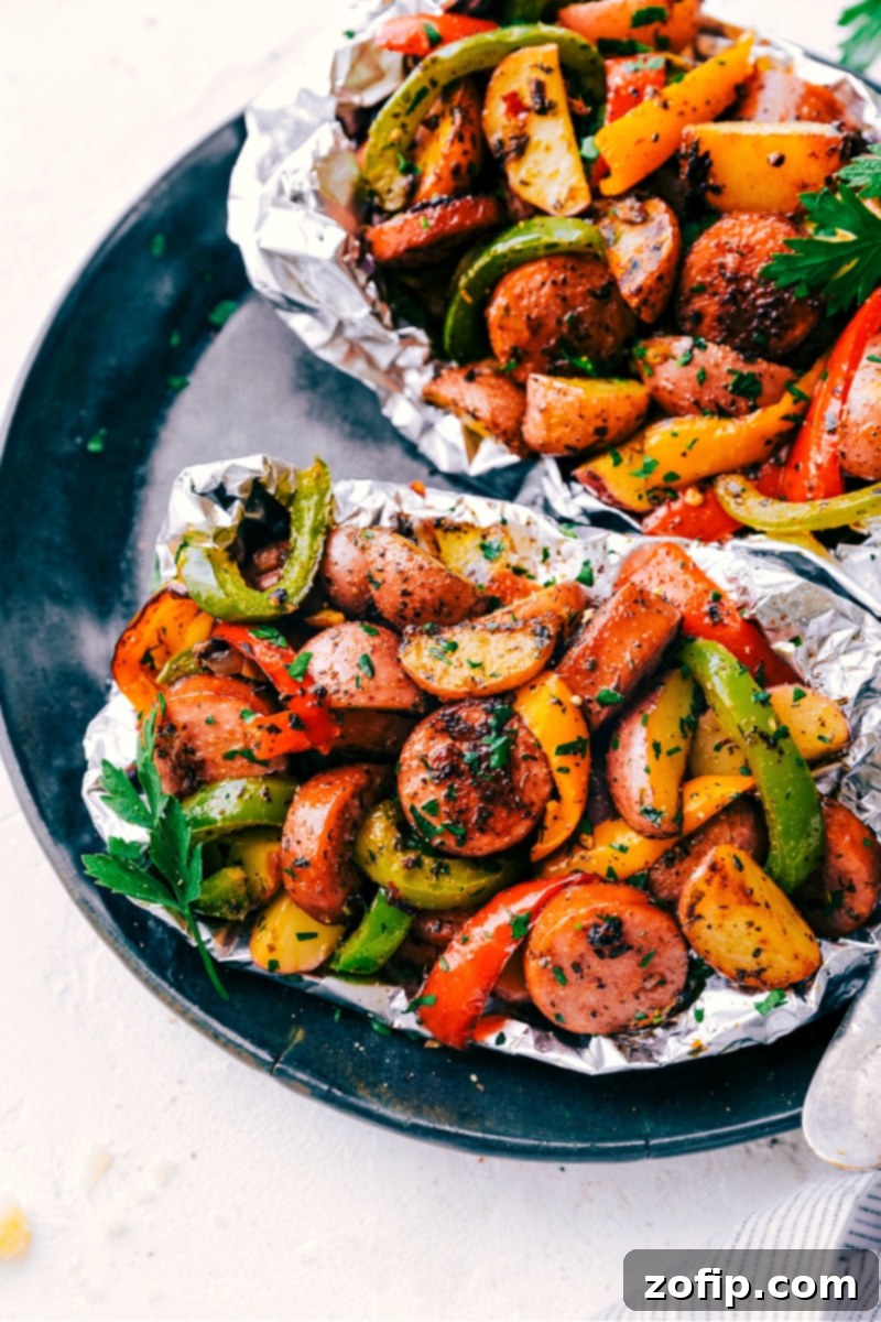 Plate of Foil Pack Italian Sausage and Veggies garnished with fresh parsley