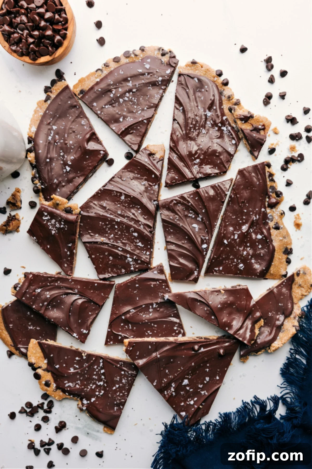 Delicious Cookie Dough Bark covered in rich chocolate, elegantly broken into perfectly bite-sized pieces, showcasing its readiness to be savored and enjoyed.