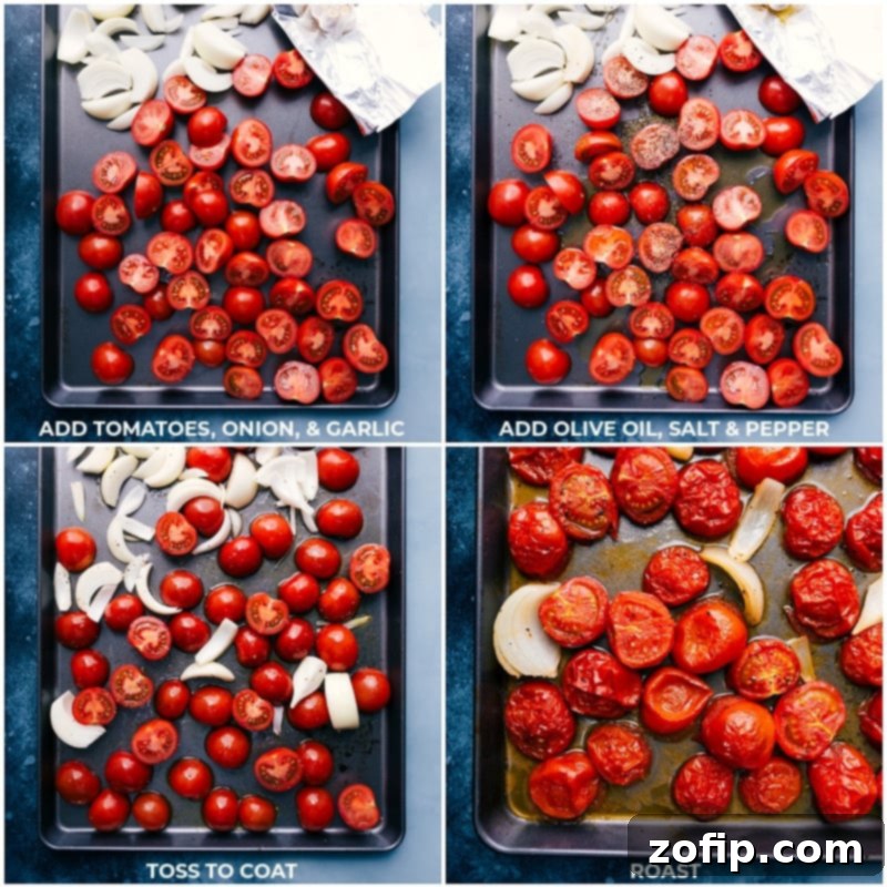Fresh tomatoes, onions, and garlic roasting on a sheet pan, creating deep, rich flavors for the soup.