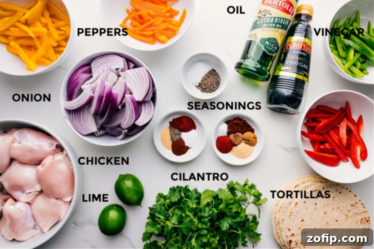All the ingredients for this recipe prepped for easy assembly, including peppers, onions, seasonings, balsamic vinegar, olive oil, and tortillas.ilantro, chicken, and limes.