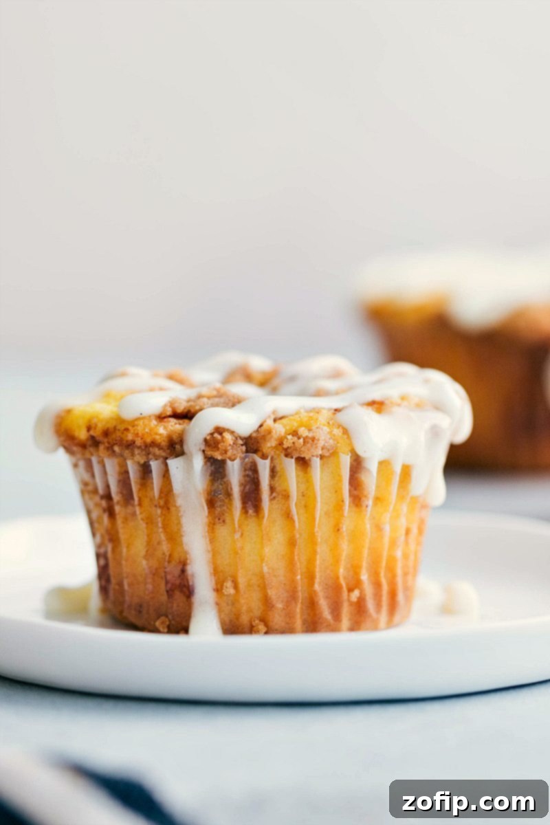 Close-up view of one perfectly glazed Cinnamon Roll Cupcake