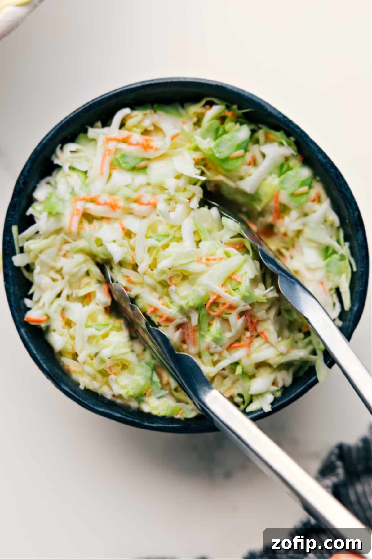 A perfectly prepared bowl of Chick-Fil-A Coleslaw copycat recipe, ready to be served.