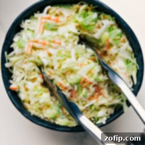 A close-up of the finished Chick-Fil-A Coleslaw in a white bowl.