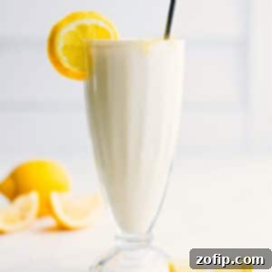 A refreshing frozen lemonade in a glass, ready to be sipped.