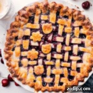 Delicious homemade cherry pie with a golden, flaky crust and bubbling fruit filling.