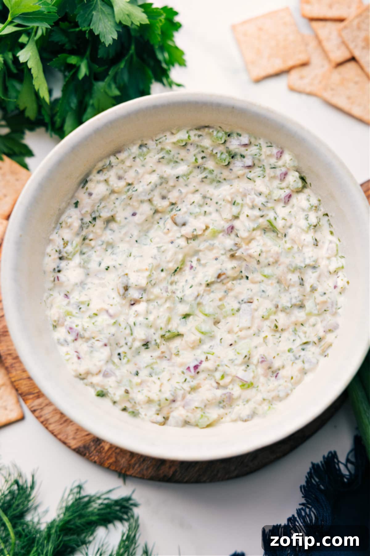 A beautifully presented bowl of creamy Green Goddess Chicken Salad, featuring tender chicken, fresh greens, and a vibrant herb dressing, ready to be enjoyed.